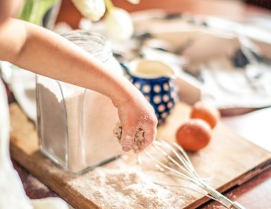 kid preparing a cake
