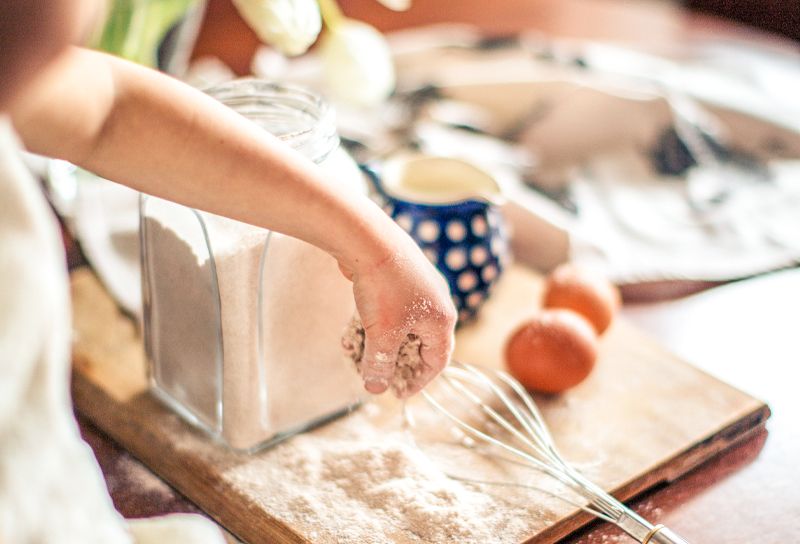 kid preparing a cake